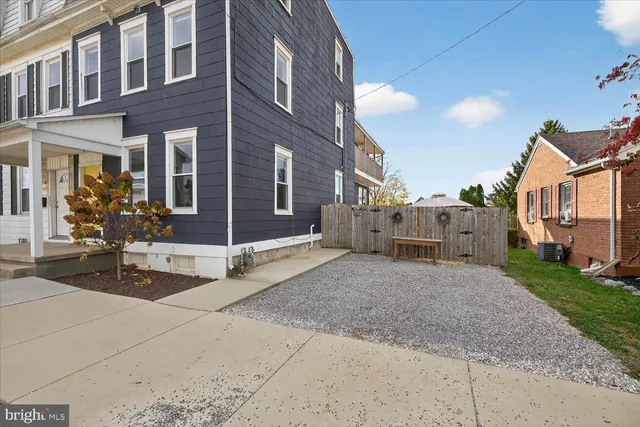 a view of a building with a yard