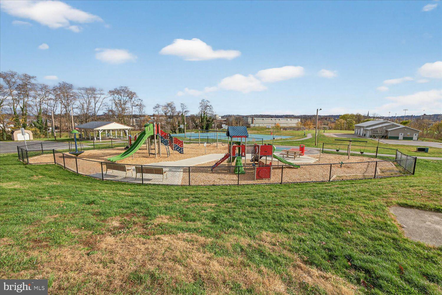 934 North Queen Street York, PA 17404 - Photo 32 of 35 swimming pool with outdoor seating and lots of trees in the background