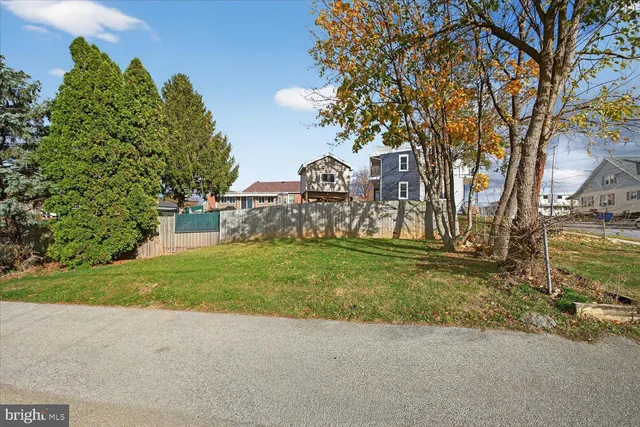 an aerial view of a house with outdoor space