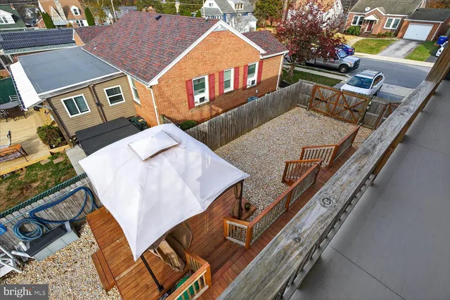 a view of a house with a yard and sitting area