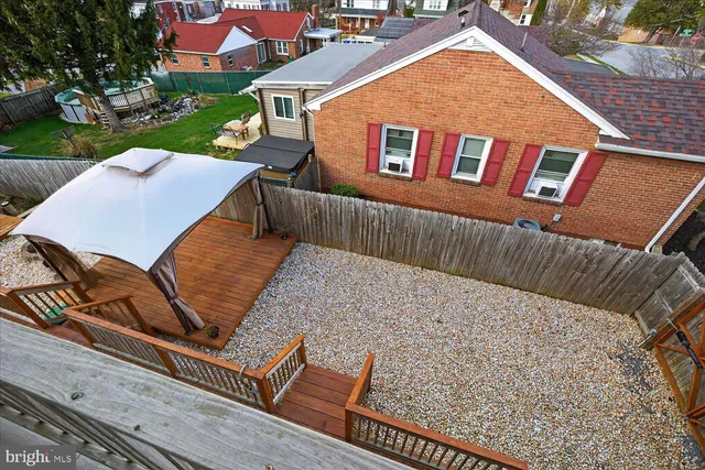 a view of a swimming pool with a yard