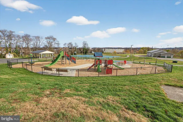 a view of a swimming pool and a yard