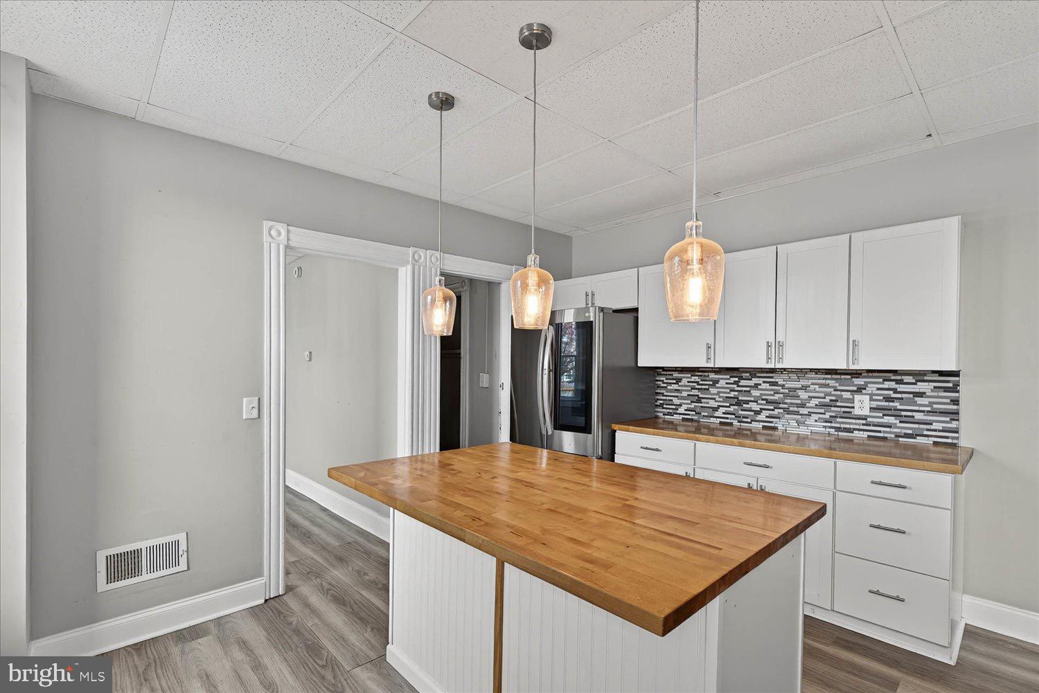 934 North Queen Street York, PA 17404 - Photo 10 of 35 a kitchen with kitchen island a counter top space a sink stainless steel appliances and cabinets