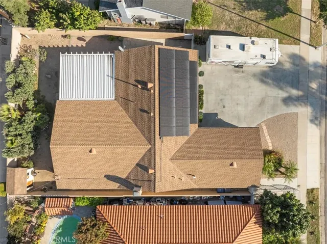 an aerial view of a house with swimming pool