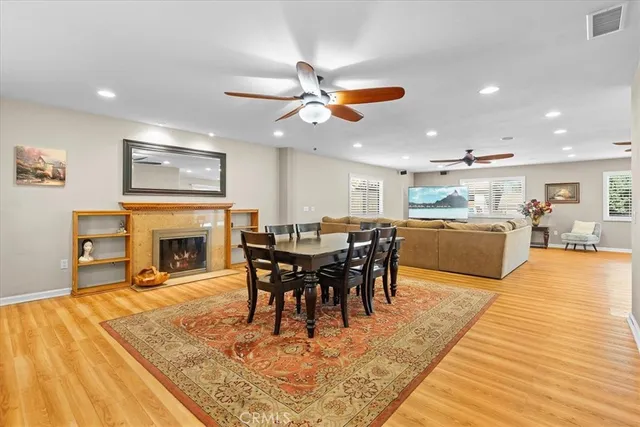 a view of a dining room with furniture window and fireplace