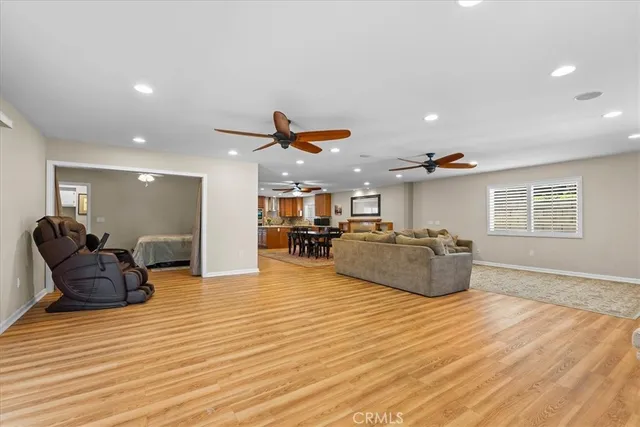 a living room with furniture and kitchen view