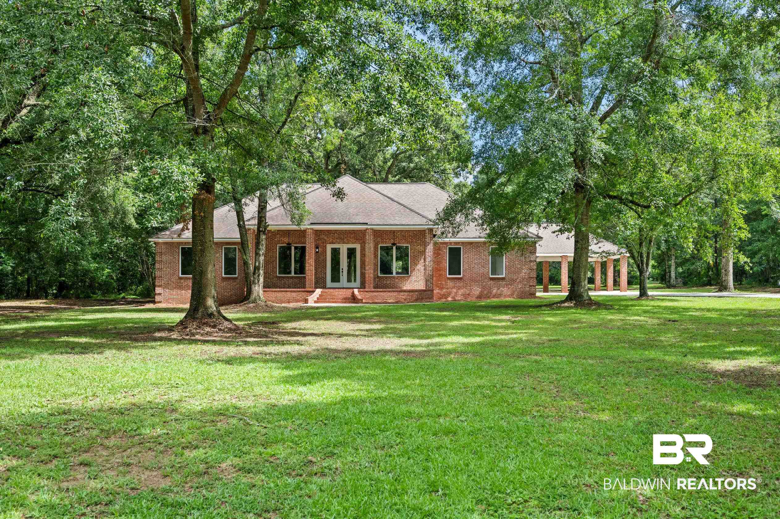 15031 Timber Ridge Drive Loxley, AL 36551 - Photo 3 of 43 Ranch-style home featuring a front lawn