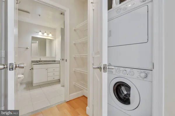 a view of a hallway with washer and dryer