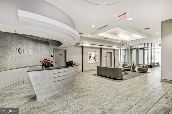 a large living room with furniture and a large window