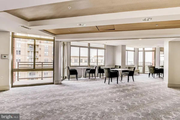 a lobby with furniture and a large window