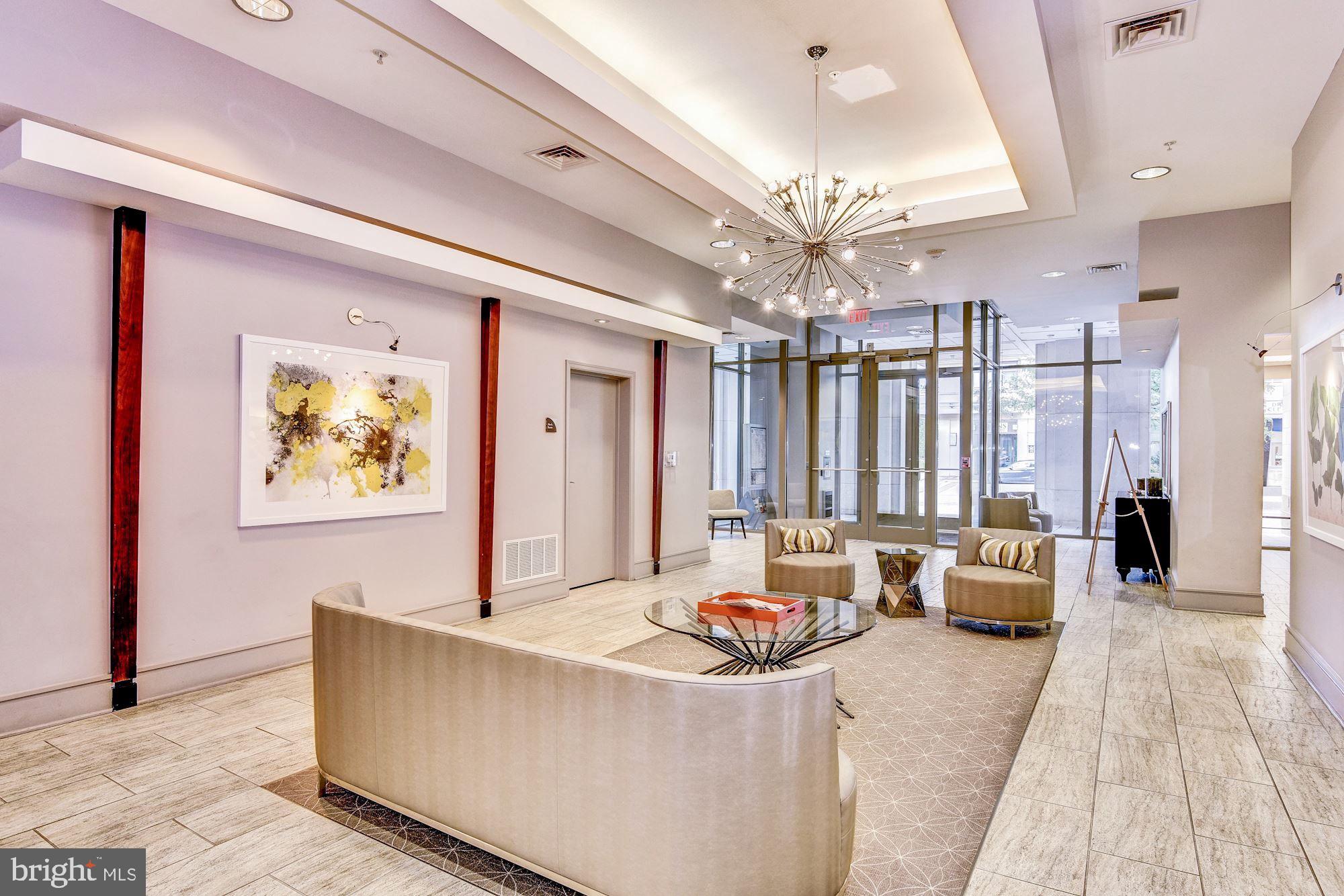 3600 South Glebe Road, Unit 434W Arlington, VA 22202 - Photo 35 of 36 a living room with furniture and a chandelier