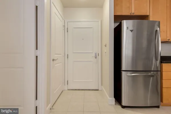 a view of a refrigerator in kitchen and a refrigerator