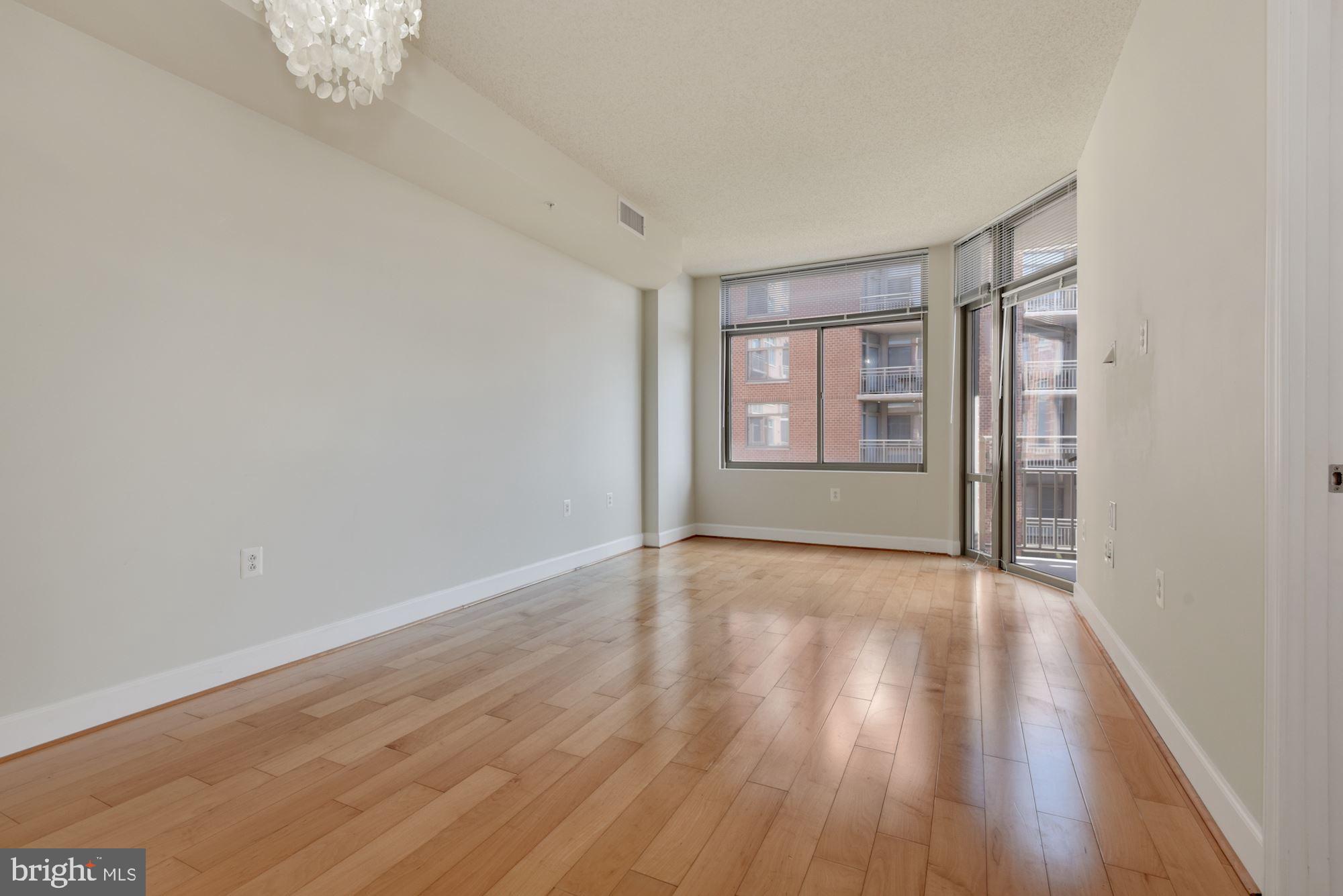 3600 South Glebe Road, Unit 434W Arlington, VA 22202 - Photo 7 of 36 wooden floor in an empty room with a window