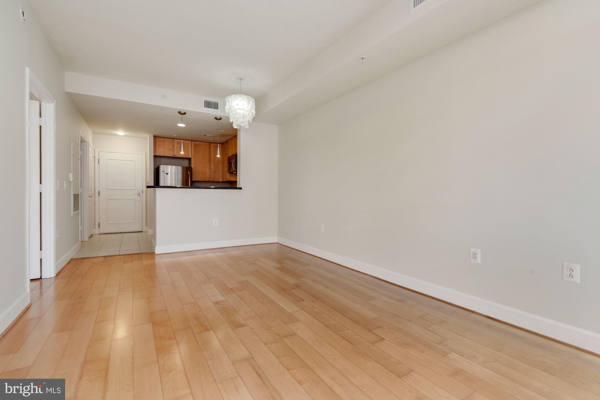 3600 South Glebe Road, Unit 434W Arlington, VA 22202 - Photo 10 of 36 a view of a kitchen with a sink and a refrigerator