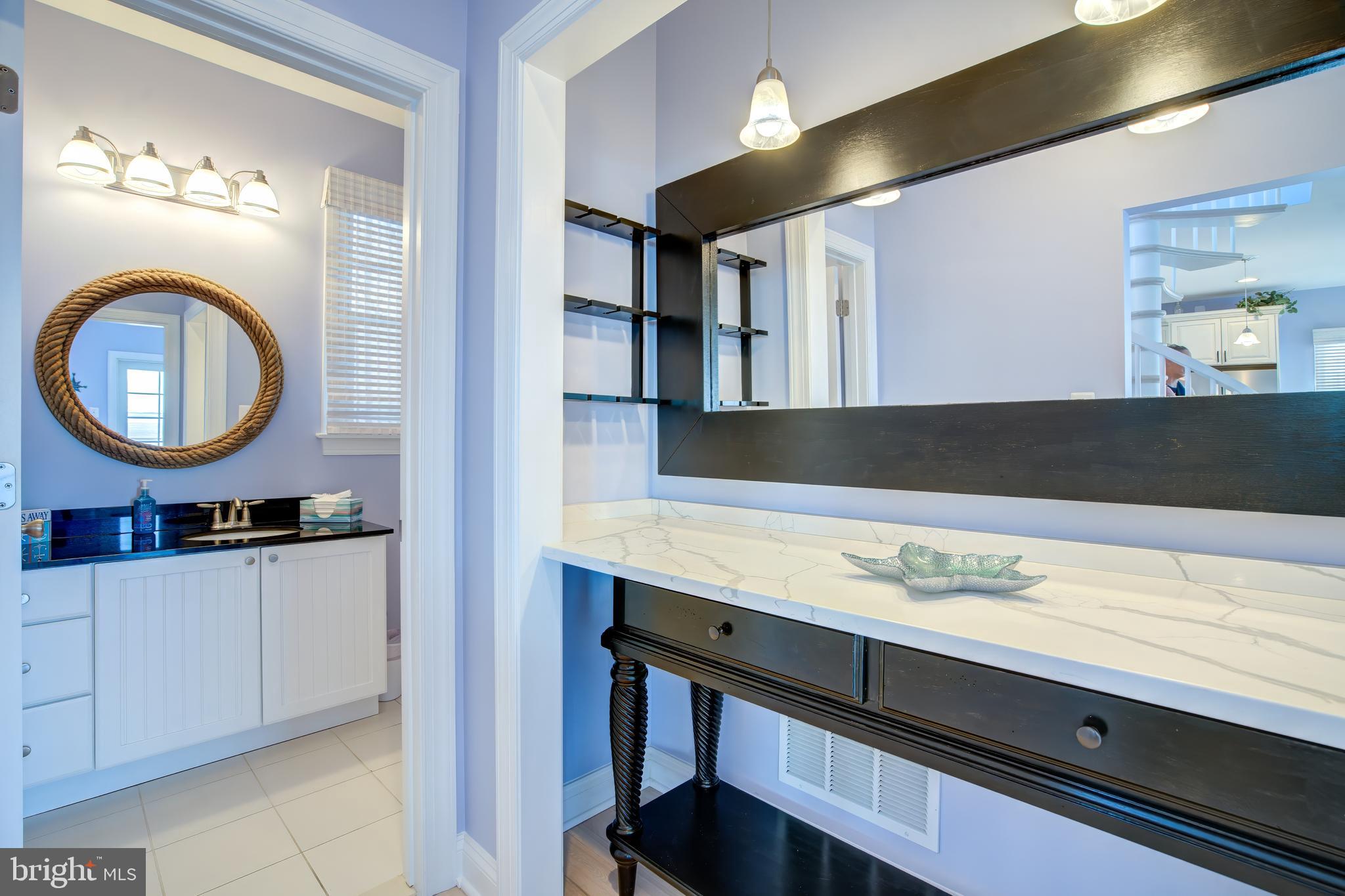 2811 Bay Drive Sparrows Point, MD 21219 - Photo 10 of 66 a bathroom with a sink a mirror and a toilet