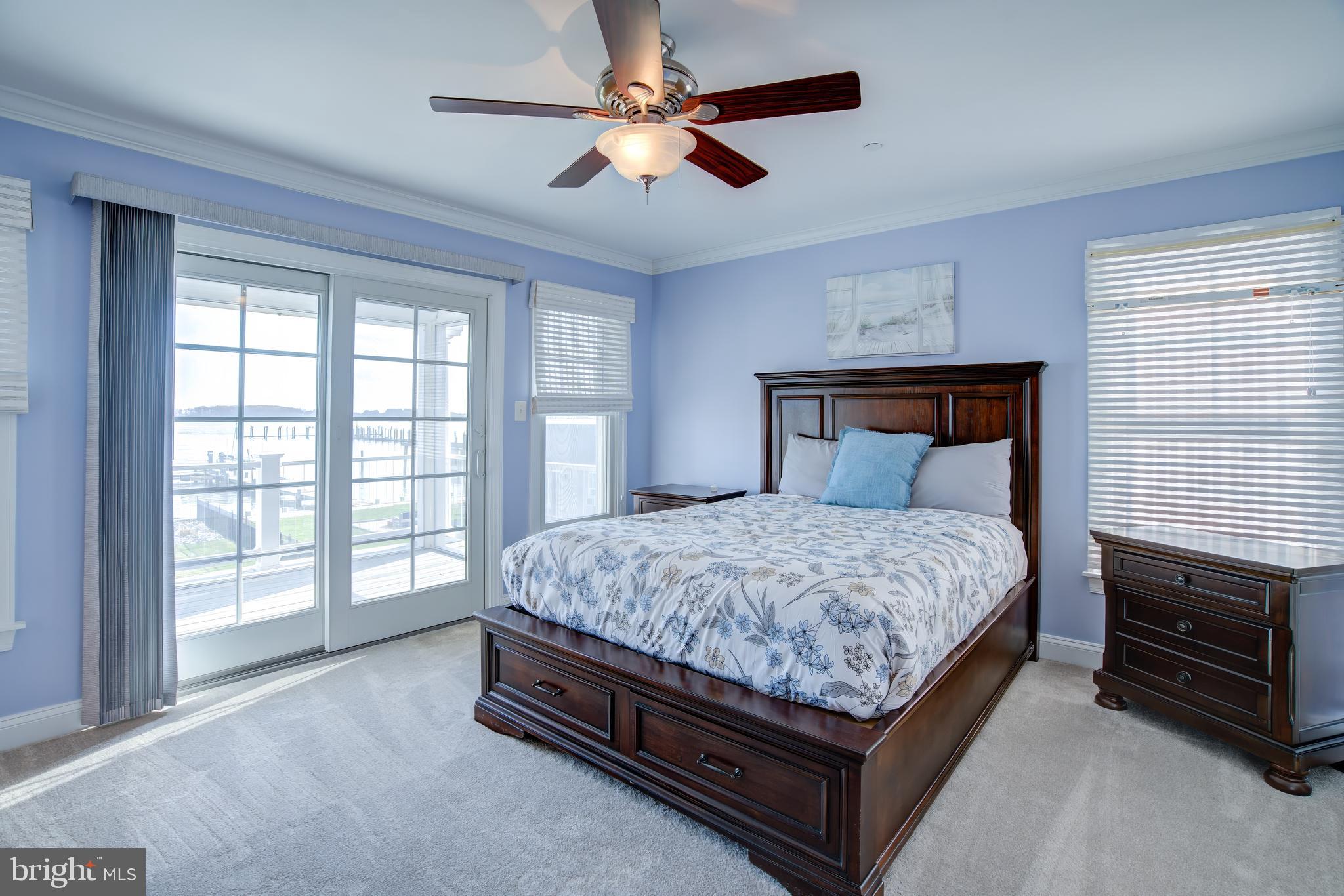 2811 Bay Drive Sparrows Point, MD 21219 - Photo 18 of 66 a bed sitting in a room next to a balcony