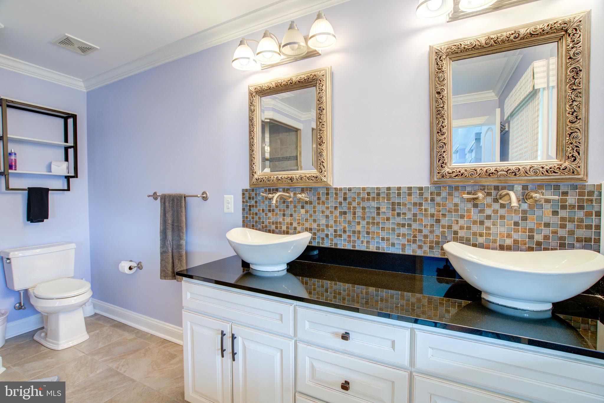 2811 Bay Drive Sparrows Point, MD 21219 - Photo 21 of 66 a bathroom with a toilet sink and mirror