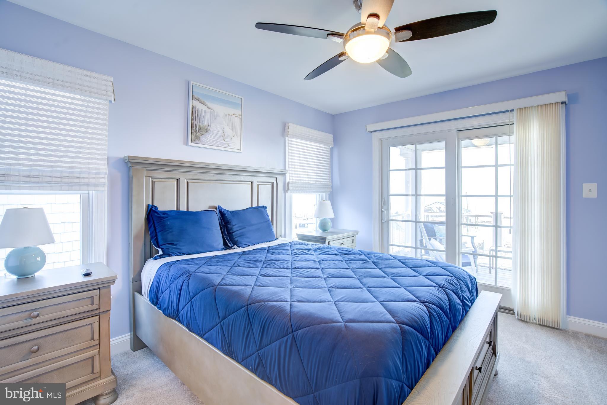 2811 Bay Drive Sparrows Point, MD 21219 - Photo 23 of 66 a bedroom with a large bed and a window