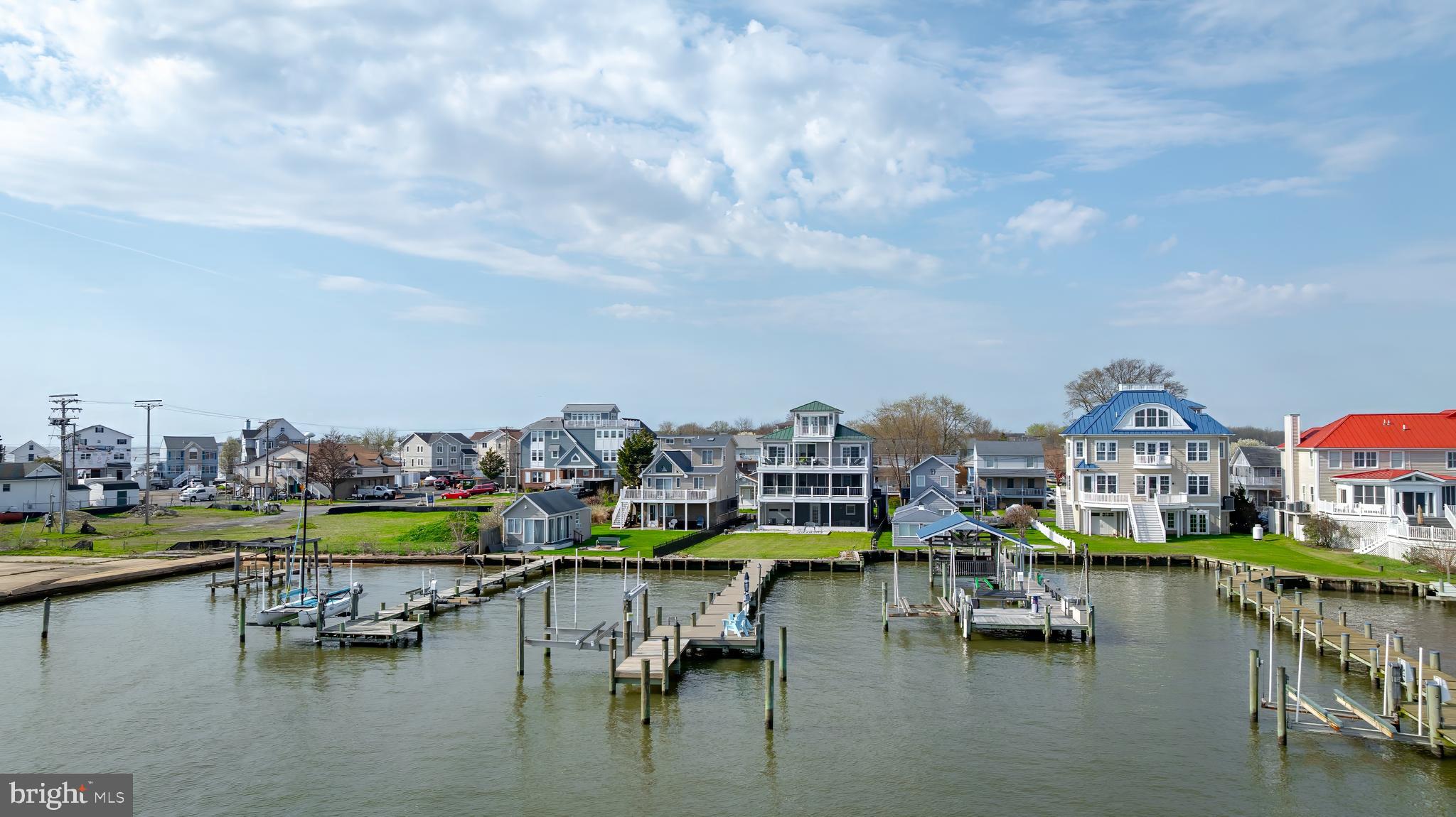 2811 Bay Drive Sparrows Point, MD 21219 - Photo 3 of 66 a view of an ocean with boats and trees in the background