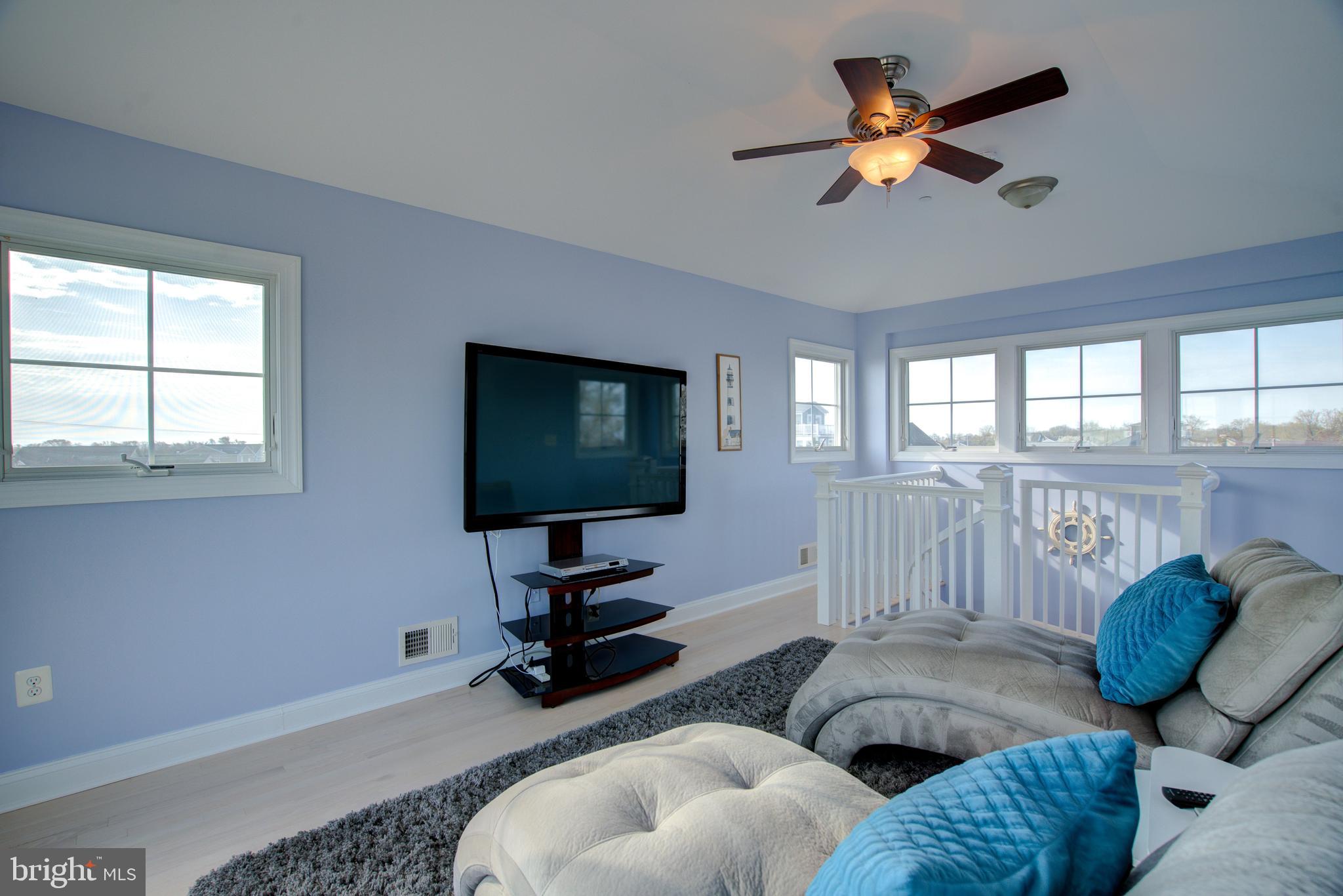 2811 Bay Drive Sparrows Point, MD 21219 - Photo 32 of 66 a living room with furniture ceiling fan and a window