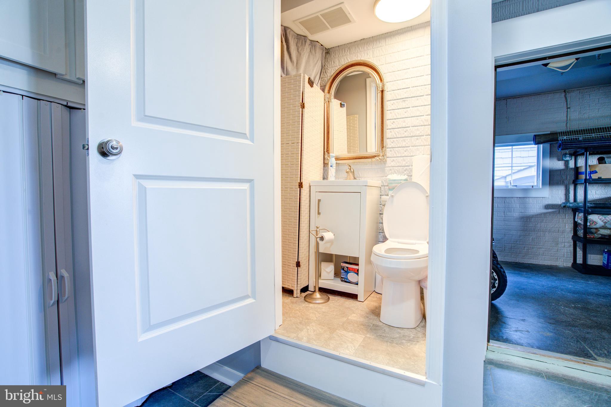 2811 Bay Drive Sparrows Point, MD 21219 - Photo 41 of 66 a view of a hallway with wooden floor windows and livingroom
