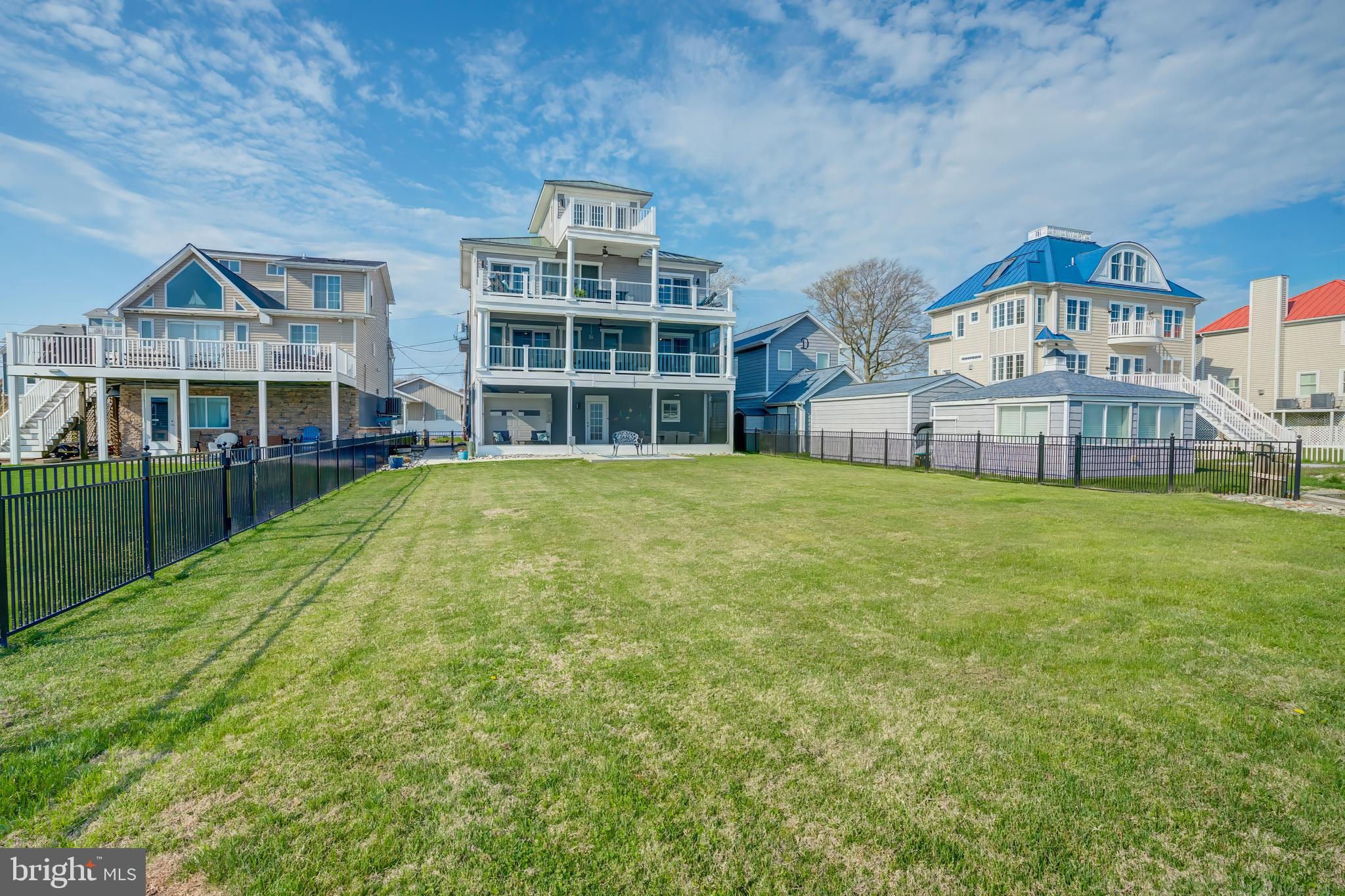 2811 Bay Drive Sparrows Point, MD 21219 - Photo 50 of 66 a view of a house with a big yard and large trees