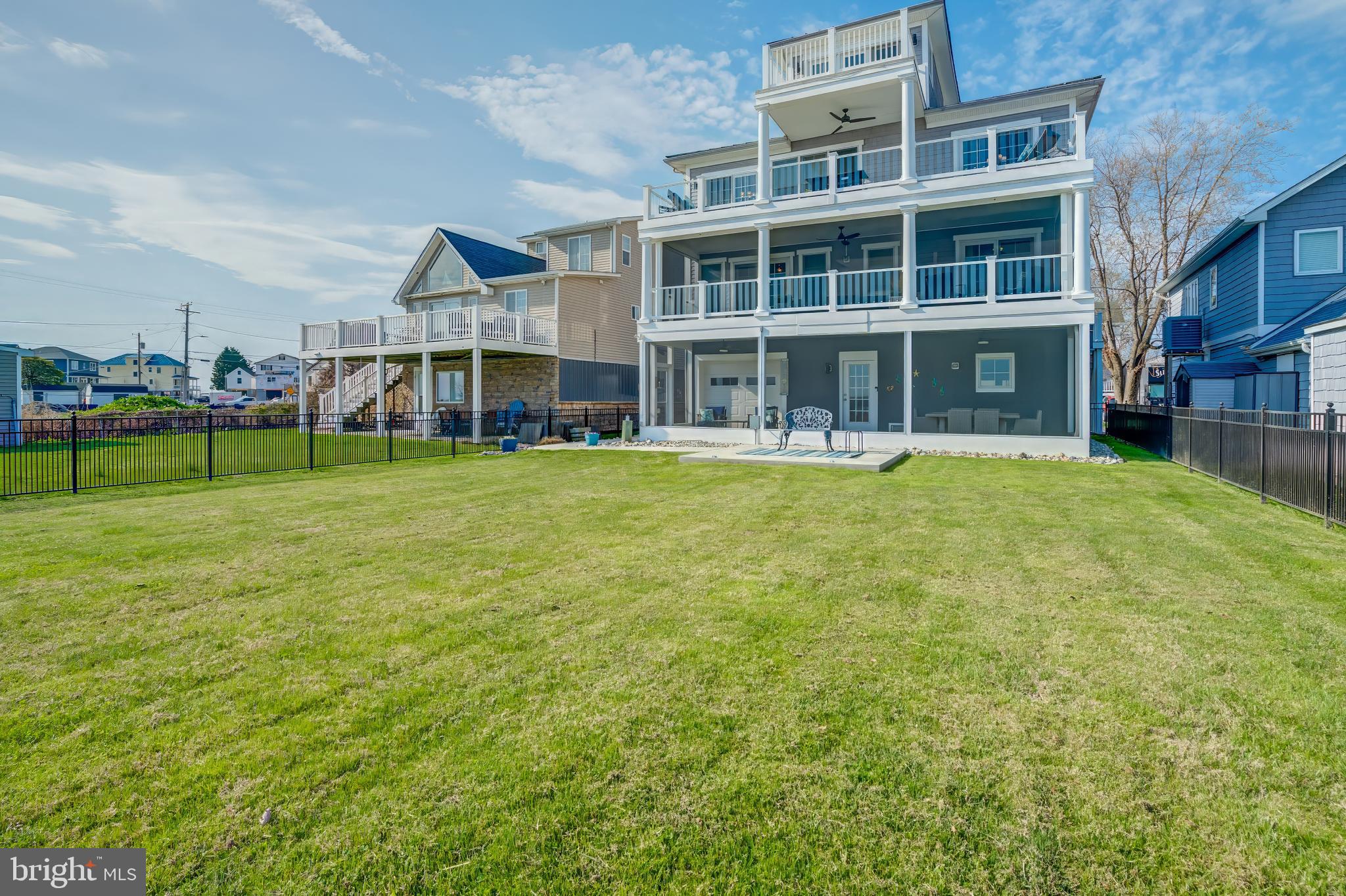 2811 Bay Drive Sparrows Point, MD 21219 - Photo 53 of 66 a view of a building with a big yard and large trees
