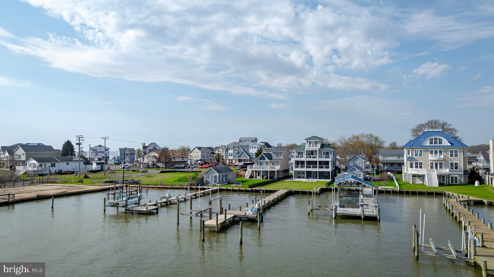 2811 Bay Drive Sparrows Point, MD 21219 - Photo 56 of 66 a view of an ocean with boats and trees in the background