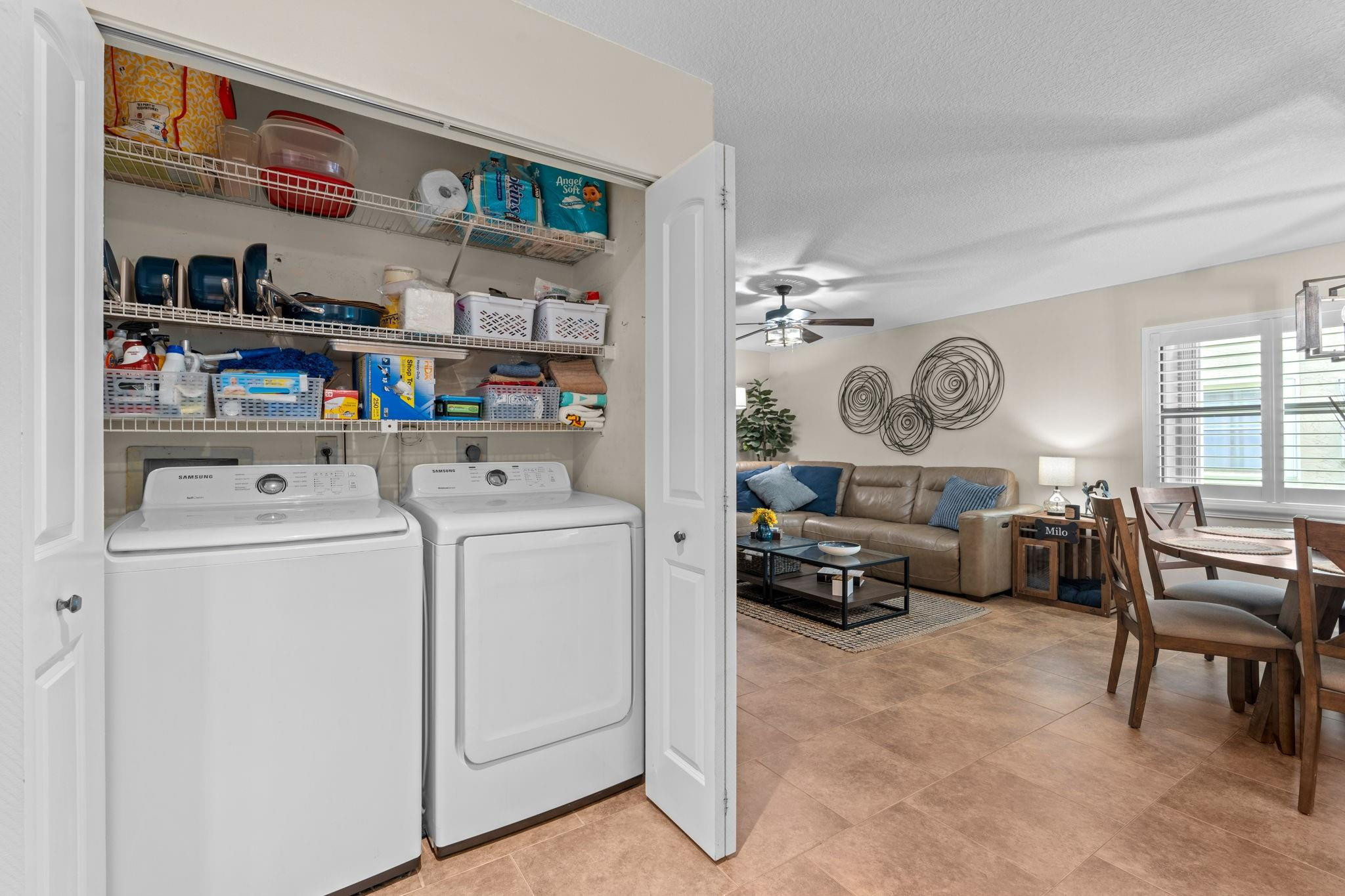 9601 Riverside Drive, Unit A6 Coral Springs, FL 33071 - Photo 11 of 25 a living room with furniture and a clock on the wall
