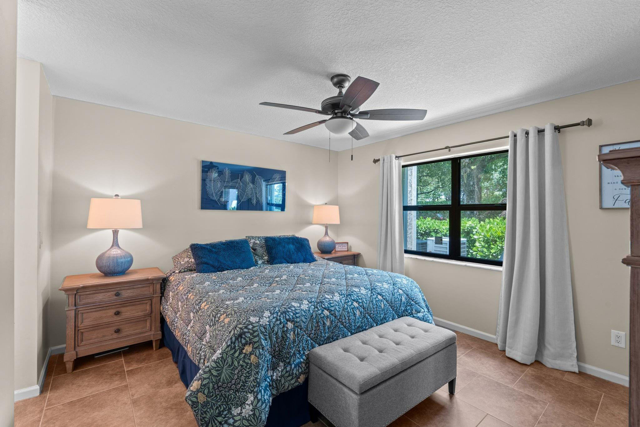9601 Riverside Drive, Unit A6 Coral Springs, FL 33071 - Photo 13 of 25 a bedroom with bed and window
