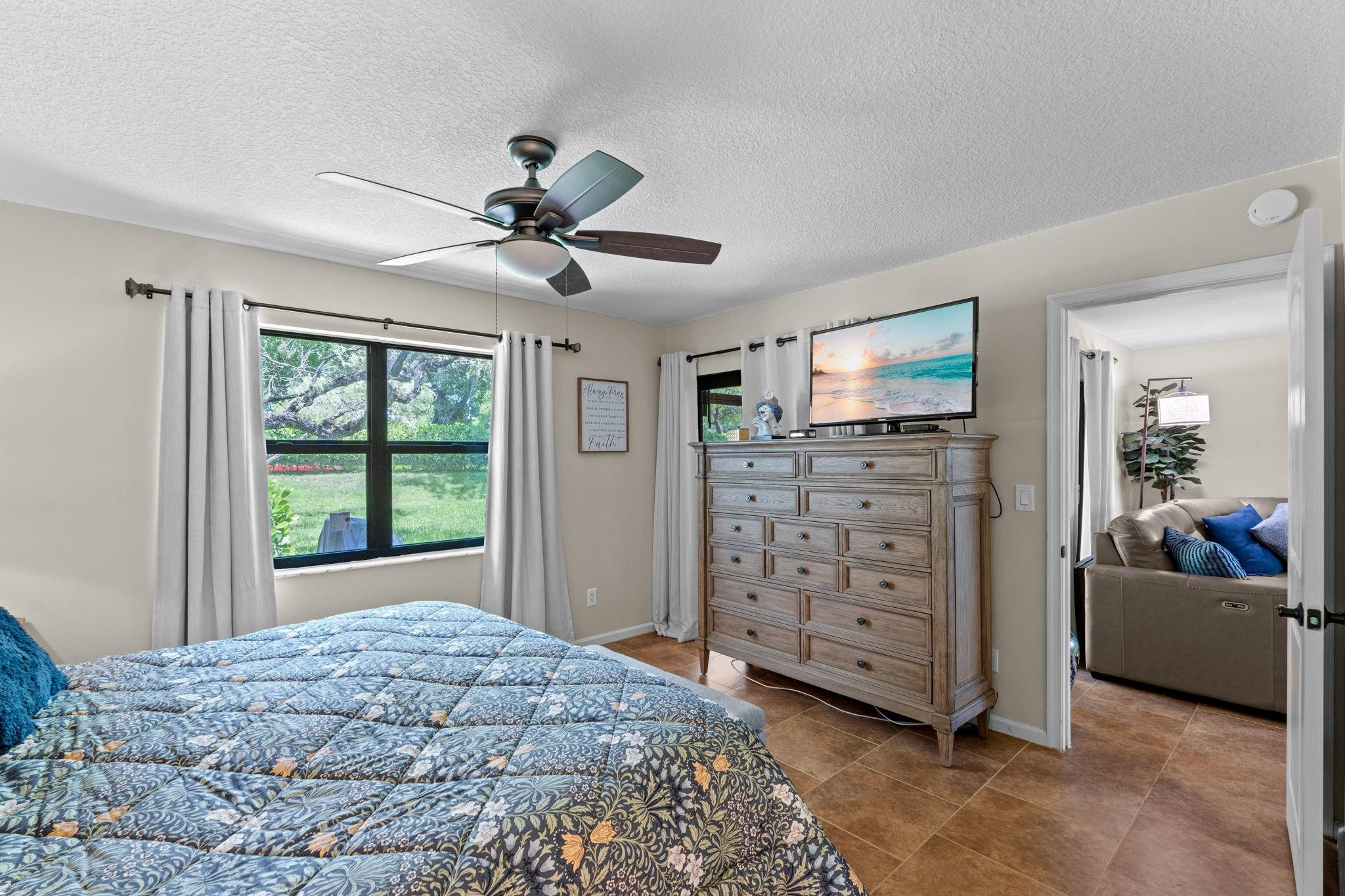 9601 Riverside Drive, Unit A6 Coral Springs, FL 33071 - Photo 14 of 25 a bed room with a bed and a television