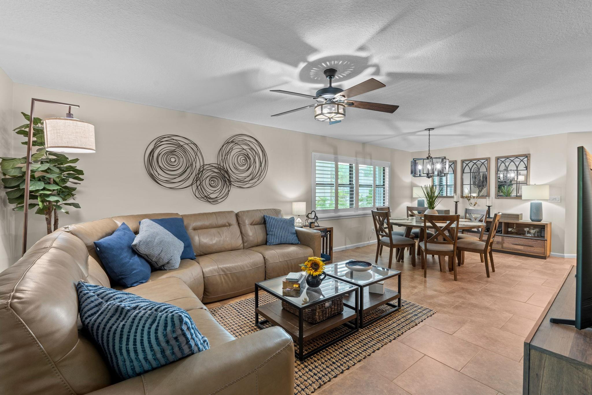 9601 Riverside Drive, Unit A6 Coral Springs, FL 33071 - Photo 6 of 25 a living room with furniture a clock and a window