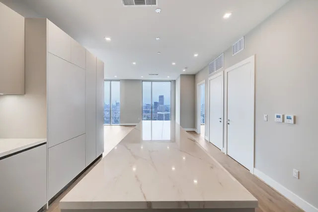 a kitchen with cabinets and appliances