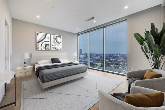 a kitchen with kitchen island sink and refrigerator