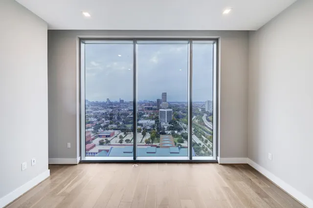a room with gym equipment and a large window