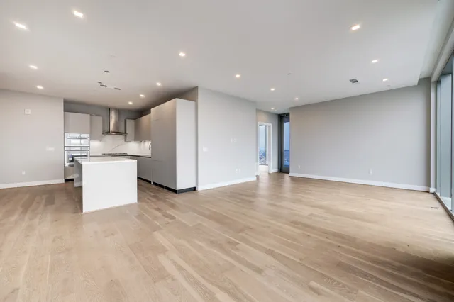 an aerial view of city and lake