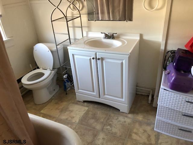 1305 A Matthews Avenue Mays Landing, NJ 08330 - Photo 7 of 14 a bathroom with a sink toilet and mirror