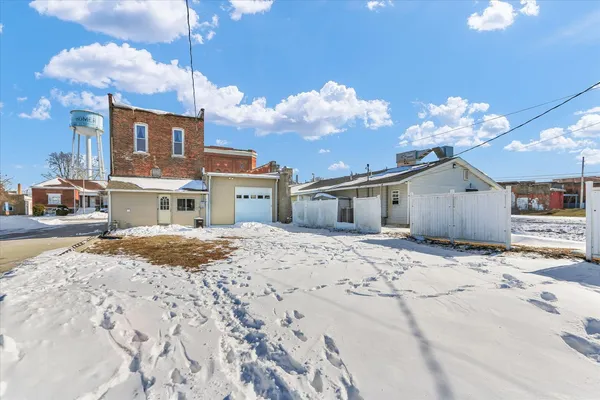 a bed room with a bed and a chandelier