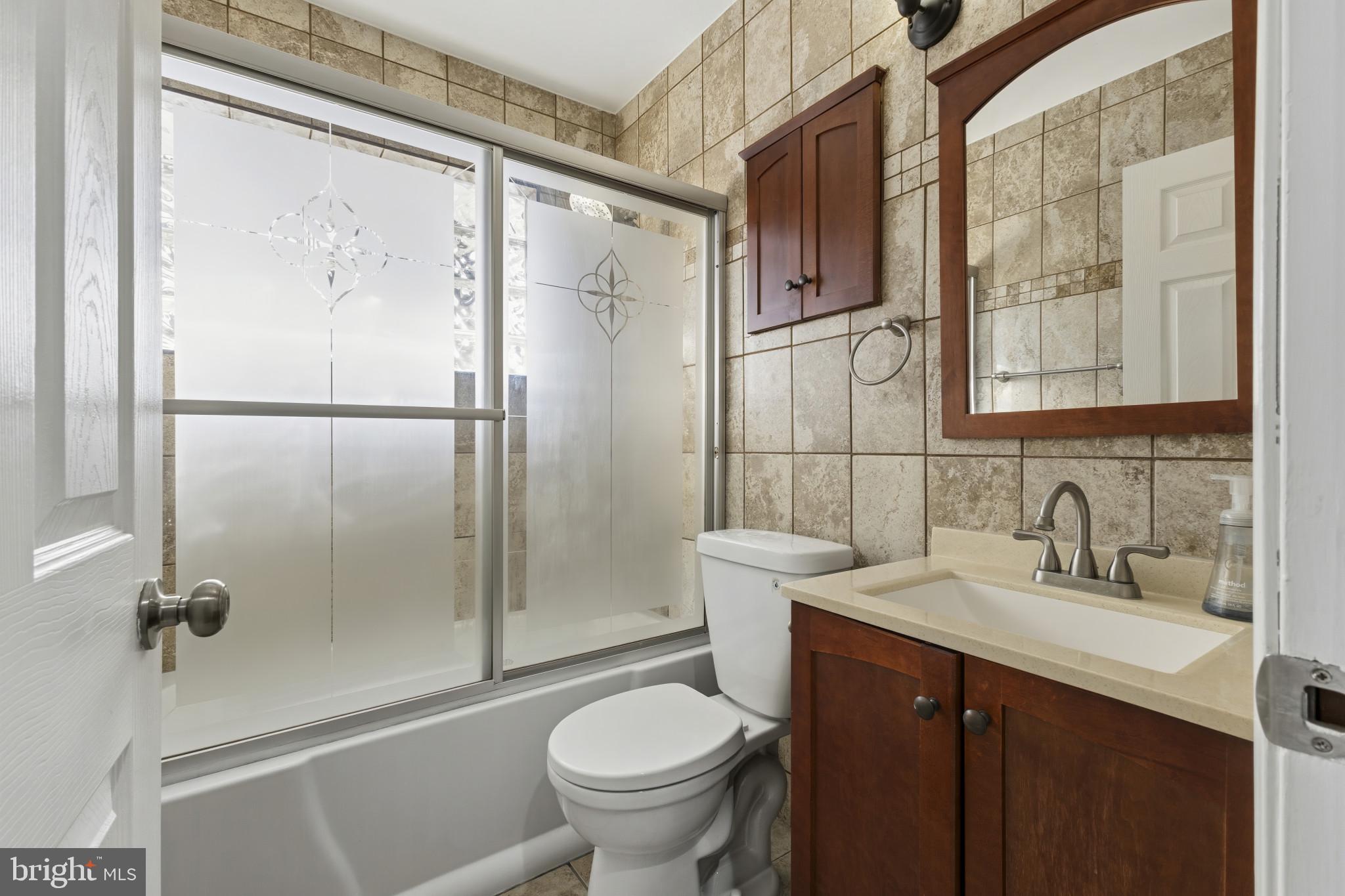 5412 Nutting Drive Springfield, VA 22151 - Photo 18 of 24 Fully updated bath with tub/shower.