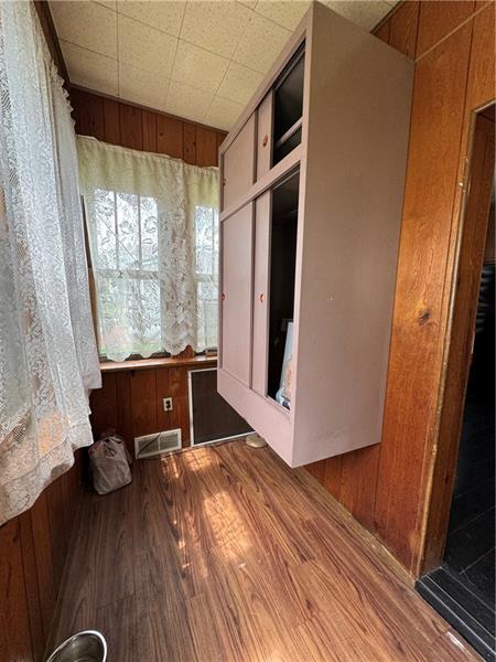 1012 11th Street McKees Rocks, PA 15136 - Photo 18 of 50 a view of a room with wooden floor and furniture