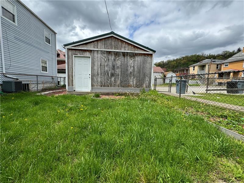 1012 11th Street McKees Rocks, PA 15136 - Photo 41 of 50 a front view of a house with a garden
