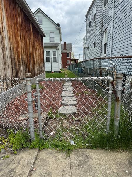 1012 11th Street McKees Rocks, PA 15136 - Photo 46 of 50 a view of a house with a yard