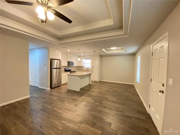 a view of a hallway with a kitchen