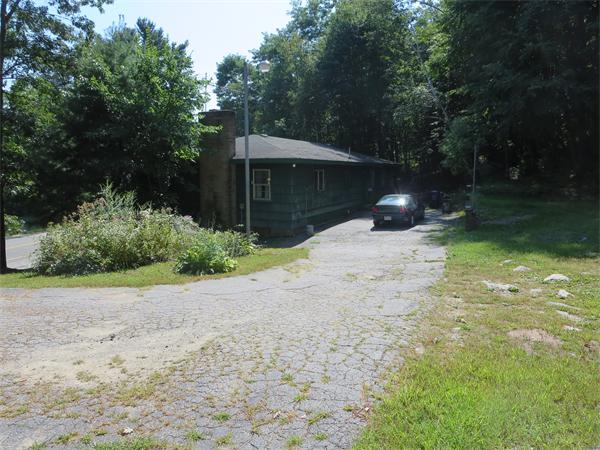 1656 Mammoth Road Dracut, MA 01826 - Photo 2 of 7 a backyard of a house with lots of green space