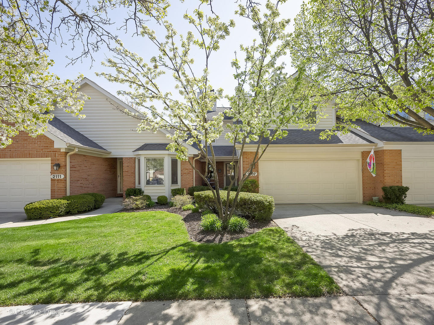 2107 Hallmark Court Wheaton, IL 60187 - Photo 1 of 1 a front view of a house with garden