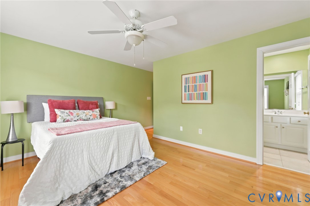4701 Regal Oaks Road Glen Allen, VA 23059 - Photo 41 of 60 a bedroom with a bed and a chandelier