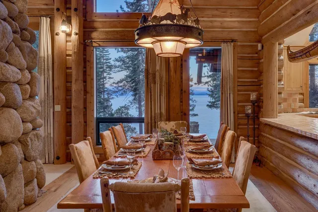 a dining room with furniture and chandelier