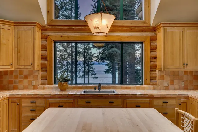 a bathroom with a sink and a large window