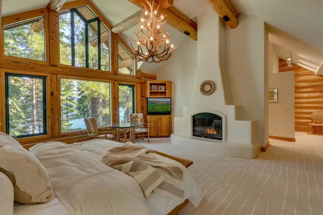 a bed room with a bed and a fireplace