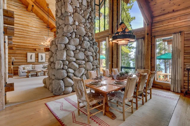 a view of a patio with table and chairs and potted plants